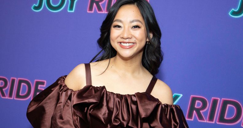 Stephanie Hsu in a poofy brown, off the shoulder dress.