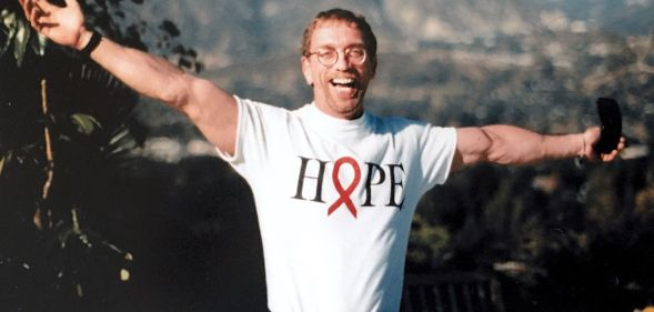 A picture of Steven Pieters, arms outstretched, wearing a Hope t-shirt.