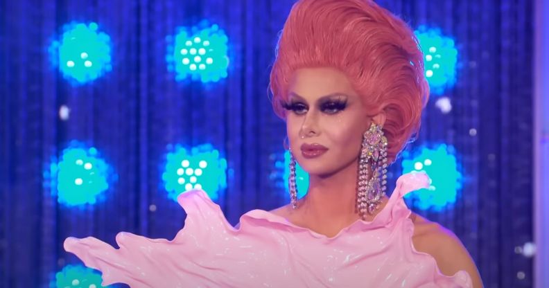 Trinity The Tuck in a plastic pink bodysuit and pink hair on All Stars 4.