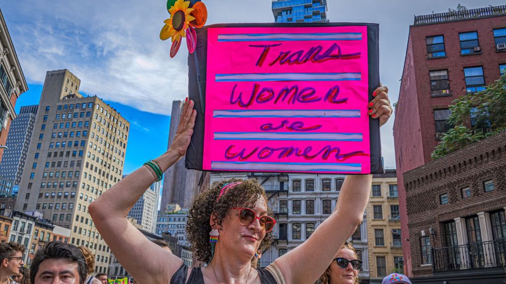 Protester holds a sign reading "trans women are women" at the Queer Liberation March in Manhattan, New York on 25 June 2023