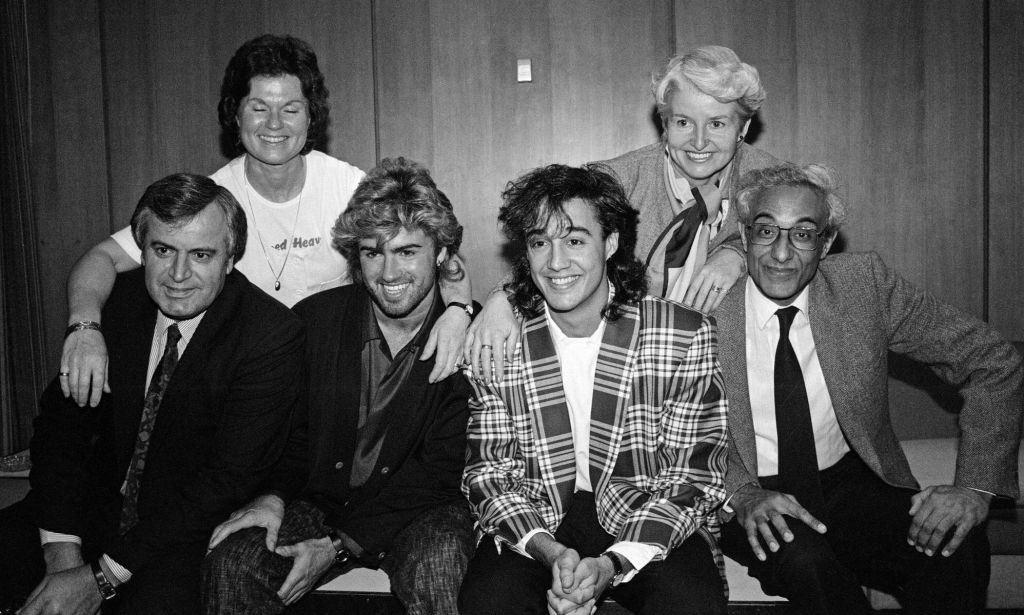 George Michael and Andrew Ridgeley of British pop group Wham! before they set off for their tour in China. Pictured with their parents.