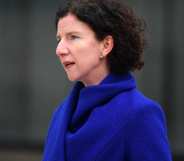 Anneliese Dodds pictured at an event. She is wearing a blue coat and is photographed outdoors.