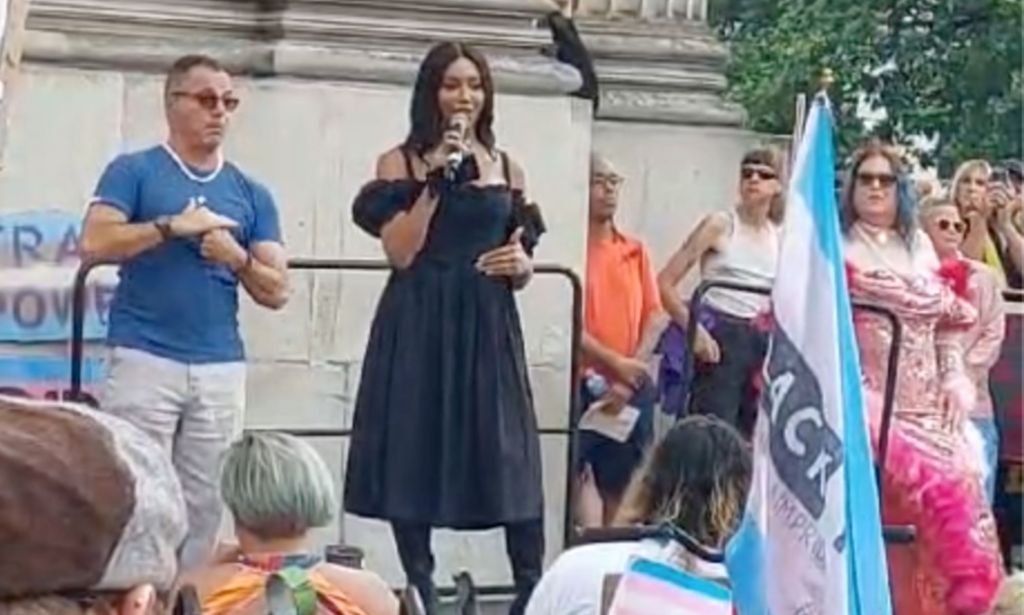 Trans activist, model and writer Munroe Bergdorf wears a black dress as she speaks to a crowd gathered for London Trans+ Pride