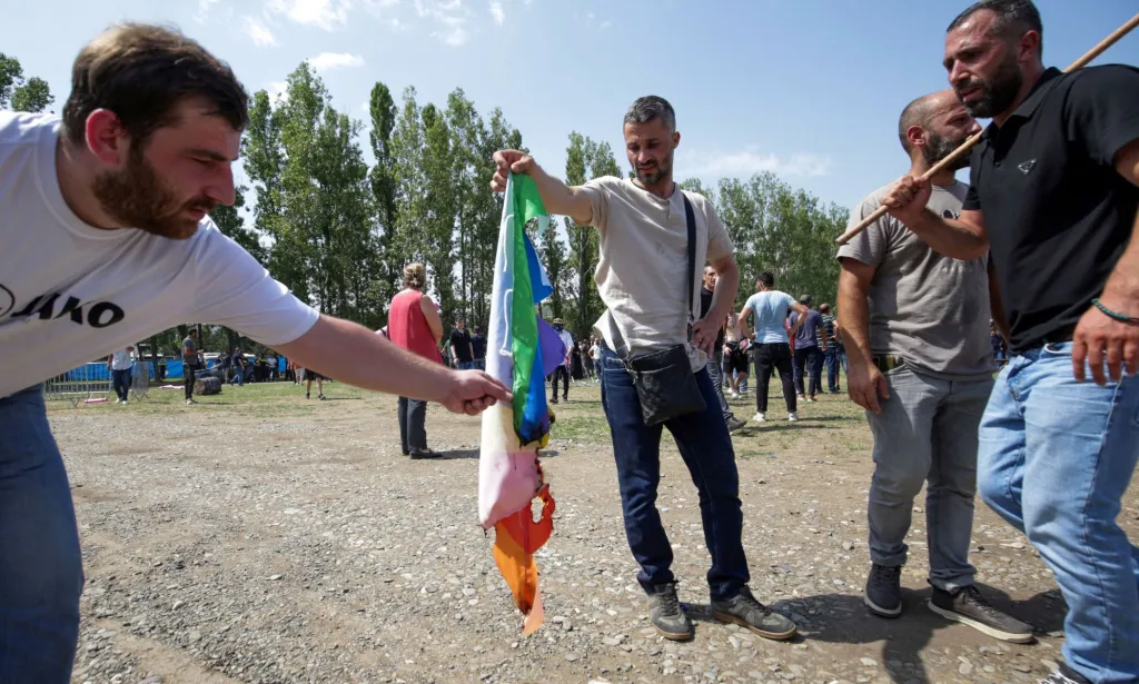 A group of anti-LGBTQ+ protestors stormed Tbilisi Pride in Georgia and set fire to rainbow flags. 