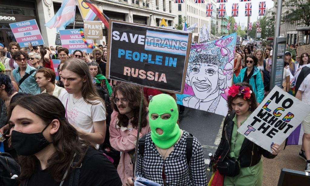 A person holds up a sign reading 'save trans people in Russia' as the Russian government approved sweeping anti-trans legislation and considers conversion therapy practices