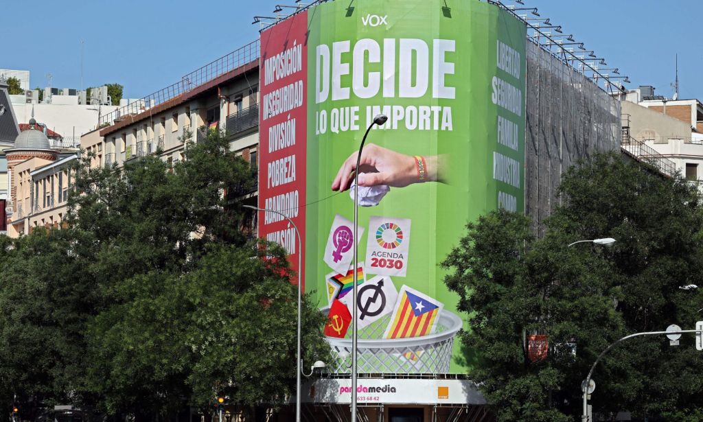 Far-right Vox displayed billboard reading 'Decide what matters' depicting a hand throwing in a bin the Catalan pro-independence flag as well as symbols for communism, feminism and the LGBTQ+ community on a building ahead of the general elections in Spain
