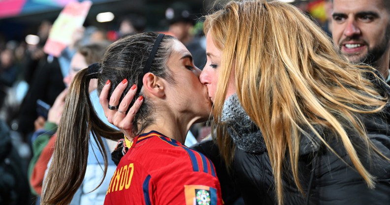 Alba Redondo of Spain kisses her partner Cristina Monleón as she celebrates her team's 5-0 victory with her family after the FIFA Women's World Cup Australia and New Zealand 2023 Group C match between Spain and Zambia at Eden Park on July 26, 2023 in Auckland / Tāmaki Makaurau, New Zealand. (Photo by Hannah Peters - FIFA/FIFA via Getty Images)