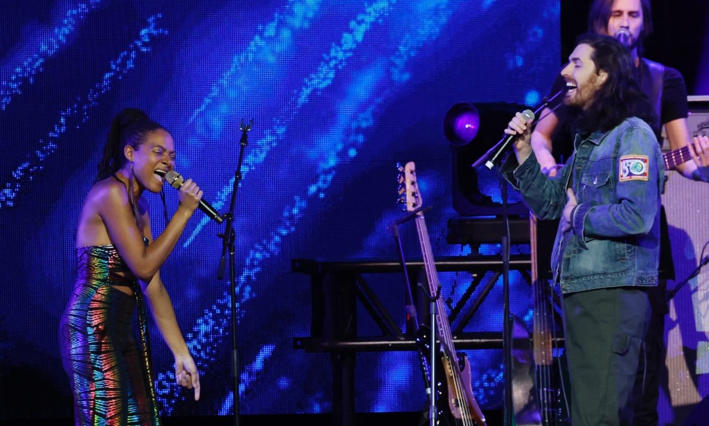 Allison Russell (L) performs with Hozier (R) at Love Rising benefit. 