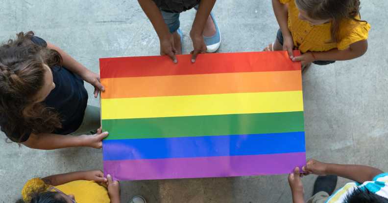 School-age children with Pride flag