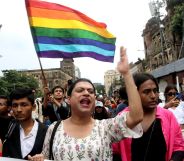LGBTQ+ activists in India waving LGBTQ+ flags.