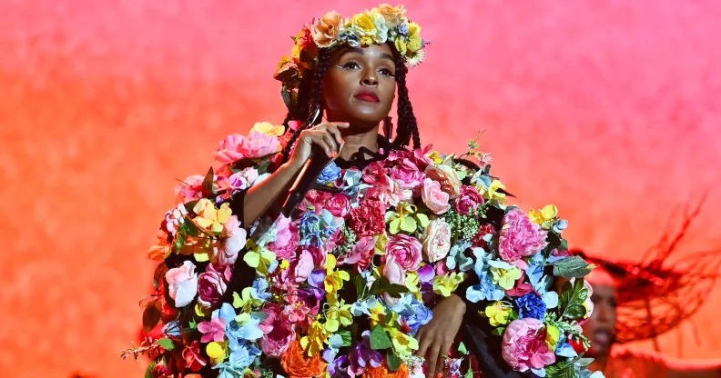 Janelle Monae performs in a dress made out flowers and a flower crown.