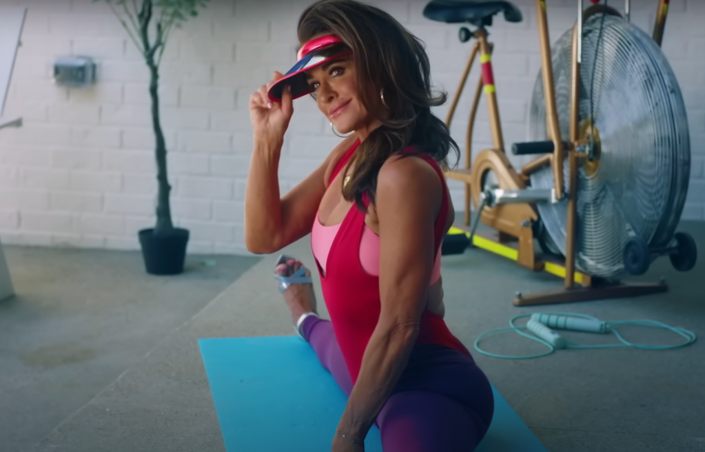Real Housewives star Kyle Richards does the splits in the music video for Morgan Wade's "Fall In Love With Me"