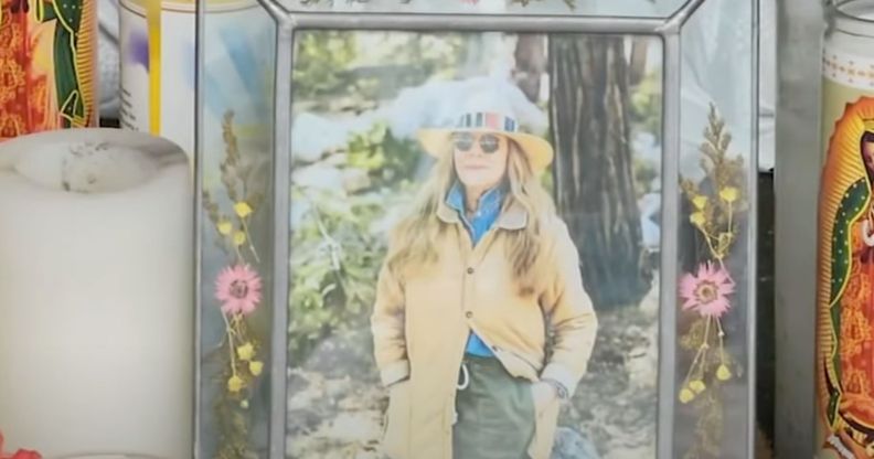 A picture of California store owner Laura Ann Carleton in a frame with flowers set up during a memorial after Carleton was fatally shot by an unidentified man who made "disparaging remarks" about an LGBTQ+ Pride flag outside her store