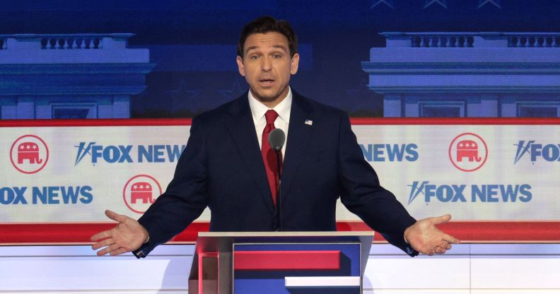 Florida governor Ron DeSantis stands behind a podium during the Republican presidential debate 2024