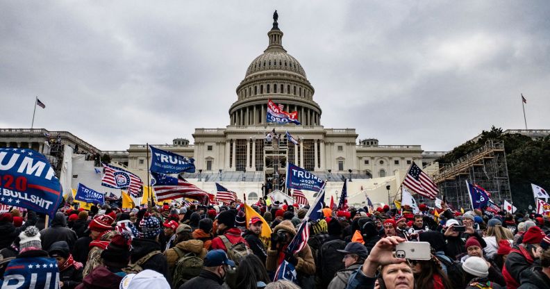 Pro-Trump supporters including members of neo-fascist group the Proud Boys storm the U.S. Capitol following a rally with President Donald Trump on January 6, 2021 in Washington, DC.