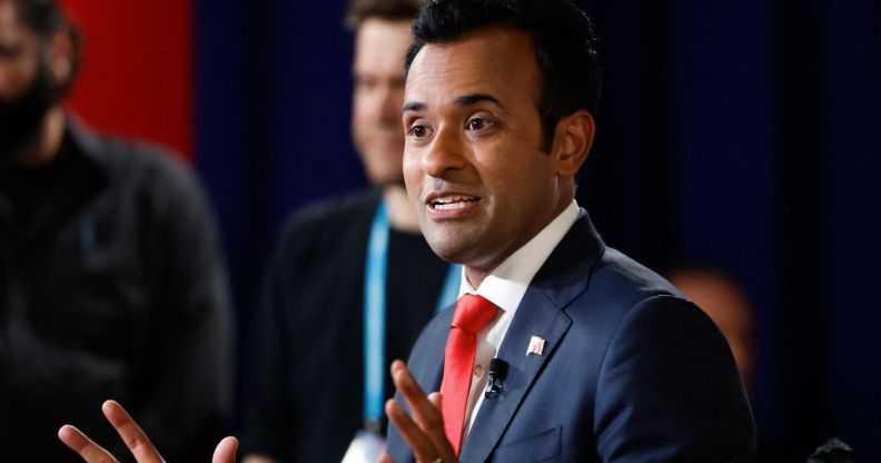 Republican presidential candidate hopeful Vivek Ramaswamy wears a white shit, red tie and blue jacket as he speaks to reporters. The White House hopeful has used his platform to speak out against the LGBTQ+ and trans community in his campaign