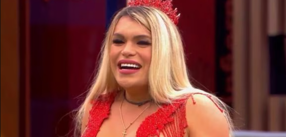 Wendy Guevara in a red top and crown.