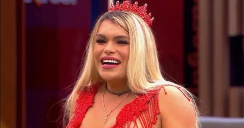 Wendy Guevara in a red top and crown.