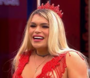 Wendy Guevara in a red top and crown.