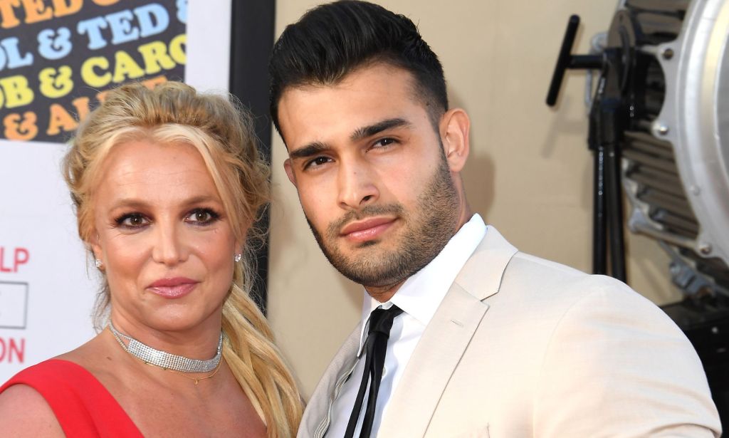 Britney Spears and Sam Asghari, who were once marriage but are now getting a divorce, stand side by side at an event