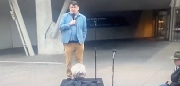 Graham Linehan performs to small crowd on street