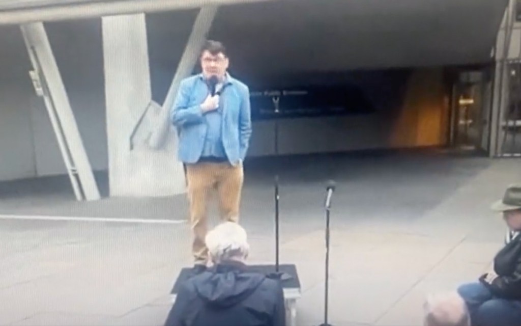 Graham Linehan performs to small crowd on street