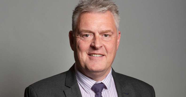 Tory deputy chair Lee Anderson pictured in his official parliamentary portrait. He is pictured wearing a suit, jacked and tie against a grey background.