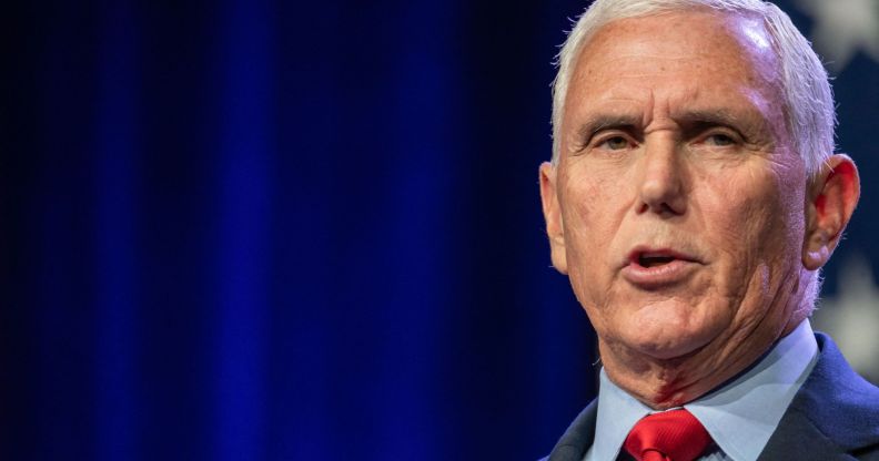 Republican presidential candidate Mike Pence, who has promised to bring back the trans military ban, wears a light blue shirt, red tie and dark jacket as he speaks at an event