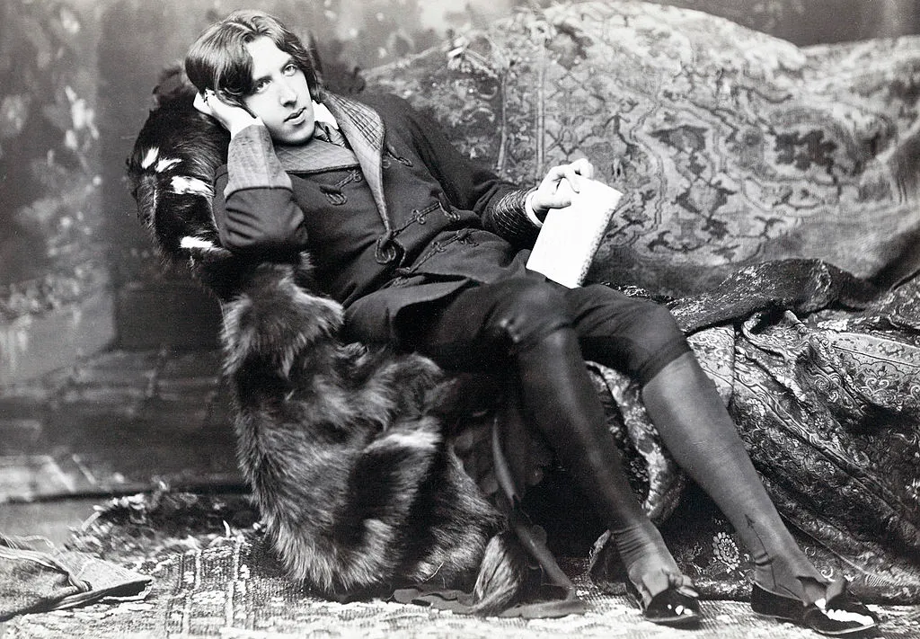 Oscar Wilde pictured in a decadent pose. 