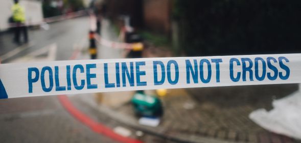 Blue and white tape with the words 'police line do not cross' is used to guard an area where a crime – whether it is a hate crime rooted in homophobia or other attack – by police