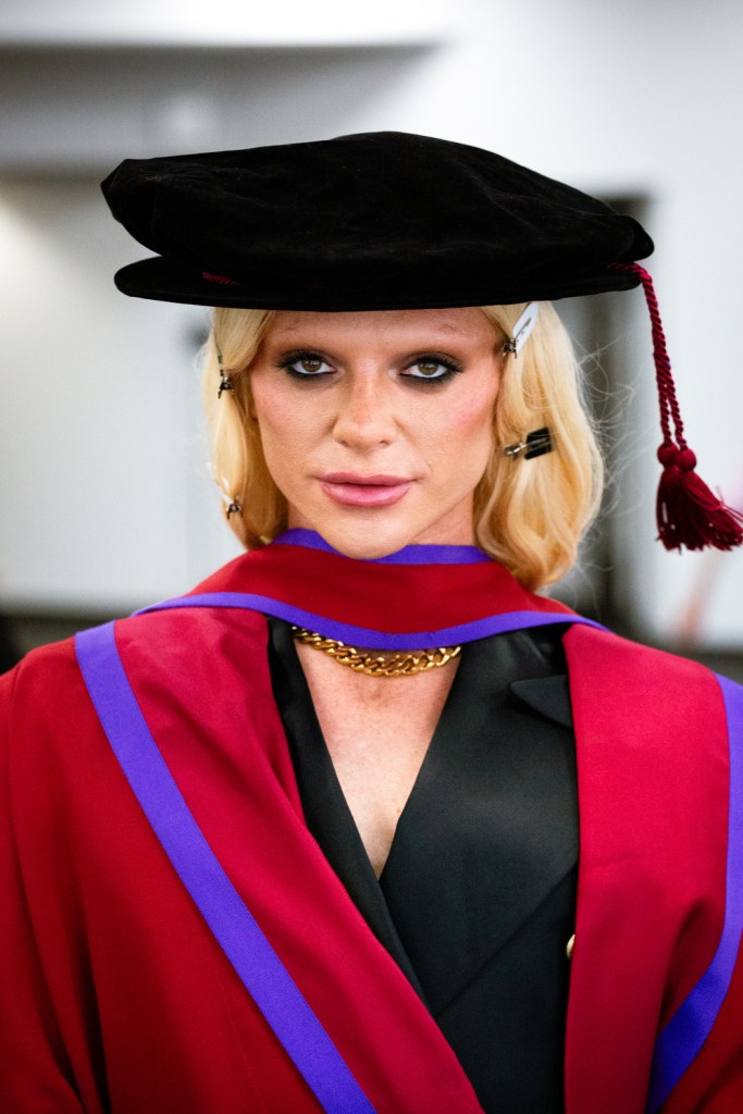 Drag star Bimini in drag and robes as she's awarded an Honorary Fellowship from Goldsmiths University.