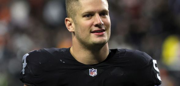 Carl Nassib wearing a football jersey on the pitch.