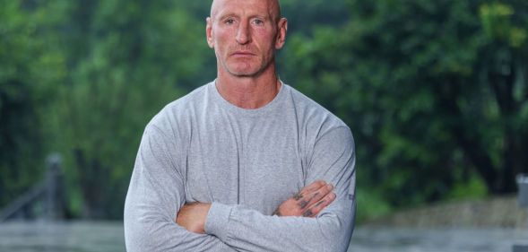 Gareth Thomas wears a grey sweatshirt and folds his arms in the promo photo for Celebrity SAS Who Dares Wins.