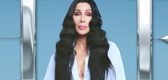 Cher with long black hair and a white shirt on the cover her her album 'Christmas'