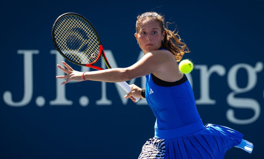 Daria Kasatkina preparing to hit the tennis ball with her racket. 