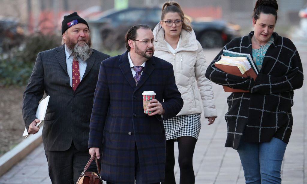 Dominic Pezzola (left) walks to the court house during his trial in December.