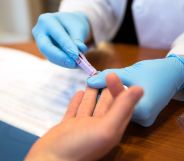 Person getting a finger-prick HIV test