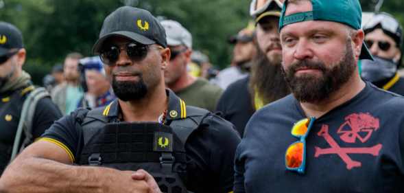 Leader of the Proud Boys Enrique Tarrio (L) and rally organiser Joe Biggs (R) at a rally in 2019