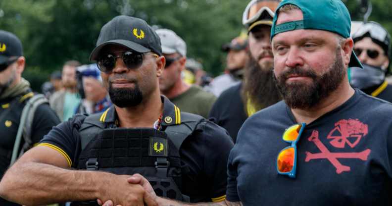 Leader of the Proud Boys Enrique Tarrio (L) and rally organiser Joe Biggs (R) at a rally in 2019
