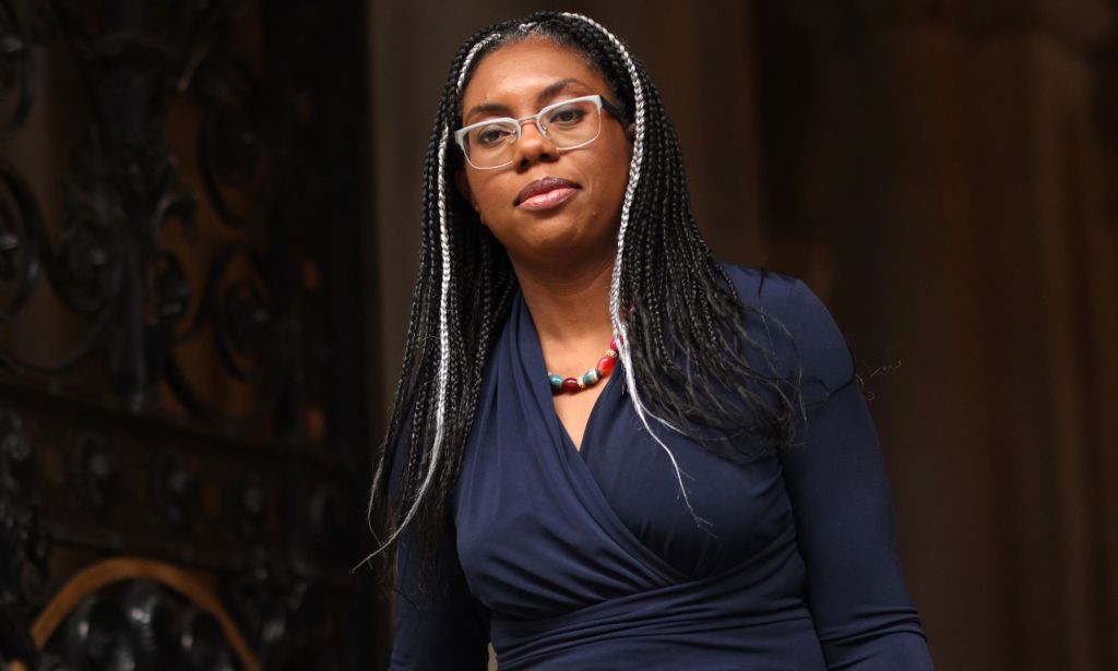 Kemi Badenoch walks through parliament gates.