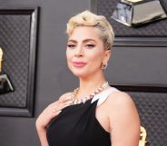 Lady Gaga in a black dress at the 2022 Grammy Awards.