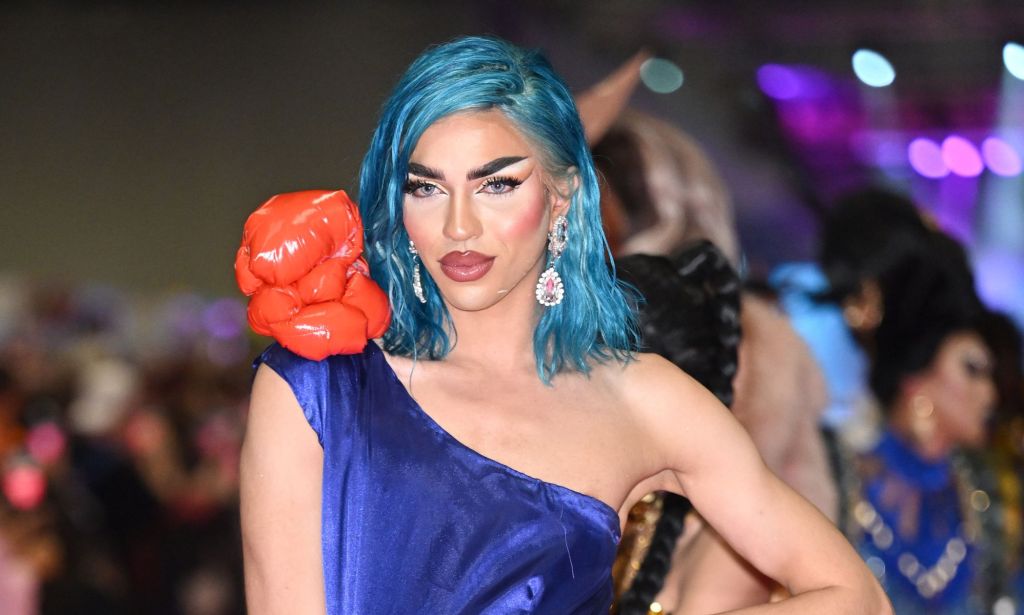 Miss Fiercalicious in a blue dress at Drag Con.