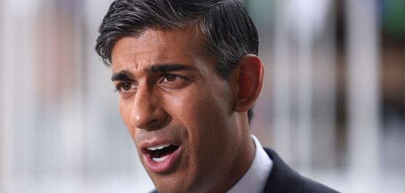 Rishi Sunak speaking at a conference.