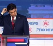 Ron DeSantis scratches his head on stage at the Republic National debate.