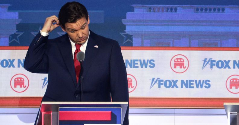 Ron DeSantis scratches his head on stage at the Republic National debate.