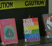 Several LGBTQ+ inclusive books are seen on a library shelf in Alabama