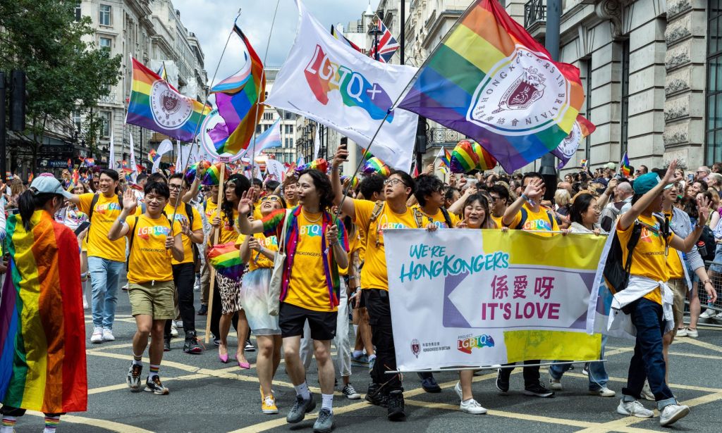 A group of LGBTQ+ activists wave rainbow Pride flags and banners calling for LGBTQ+ rights in Hong Kong including recognition of same-sex partnerships and marriage equality
