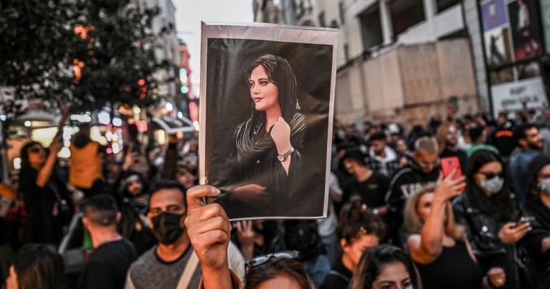 People gather together in protest one year after the death of Mahsa Amini, a Kurdish-Iranian woman who died in the custody of Iran's 'morality police'. Women and LGBTQ+ people have led the protests calling for their human rights in Iran