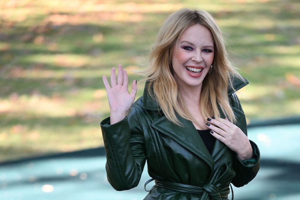 Kylie Minogue arrives to attend the catwalk presentation for British fashion house Burberry's Spring/Summer 2024 collection, at London Fashion Week. 