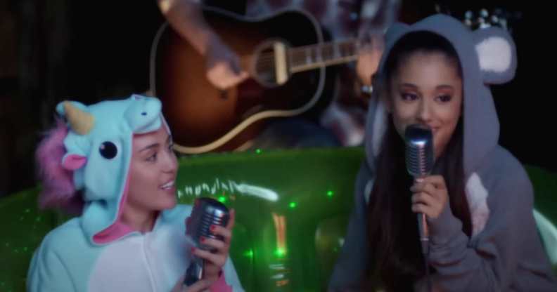Miley Cyrus and Ariana Grande sing together.